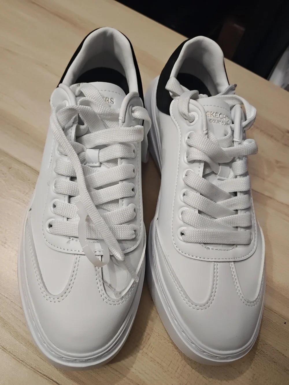 Skechers Men’s White Sneakers with Black Heel Accent 9